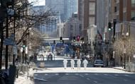 Agents continue to search for evidence on the Boston Marathon route on April 18, 2013 in Boston